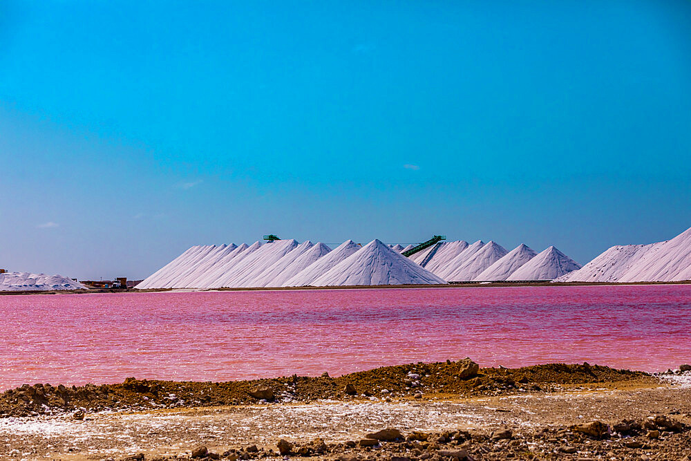 View of the pink colored ocean overlooking the Salt Pyramids of Bonaire from afar, Bonaire, Netherlands Antilles, Caribbean, Central America