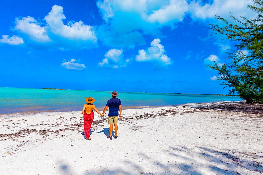 Couple enjoying the white sands and epic ocean view of Horse Stable Beach, North Caicos, Turks and Caicos Islands, Atlantic, Central America