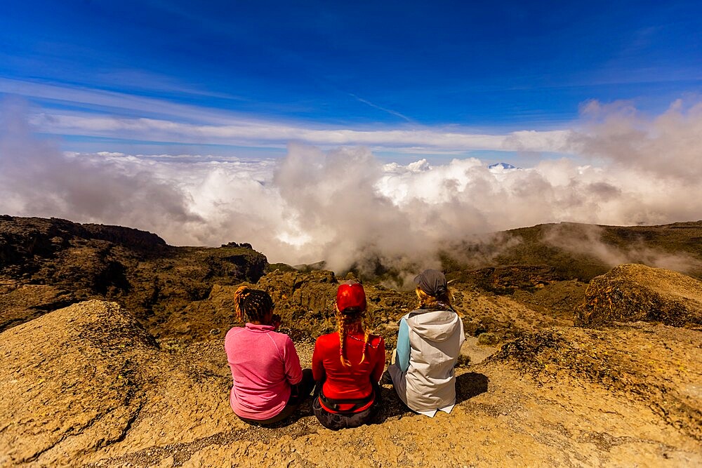 Women taking in the view on their way up Mount Kilimanjaro, UNESCO World Heritage Site, Tanzania, East Africa, Africa