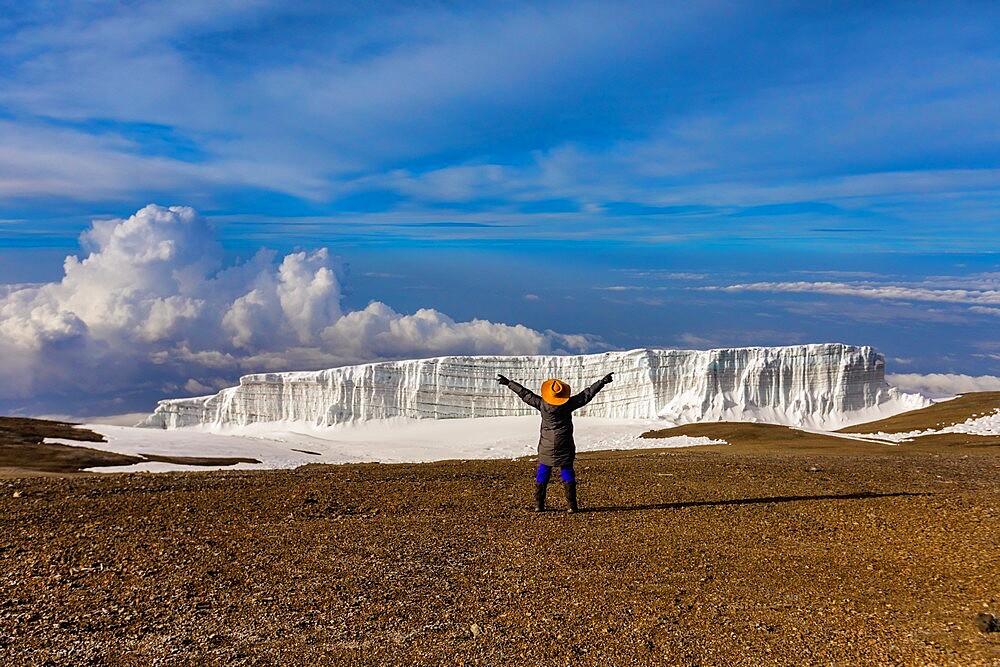 Woman enjoying the view on her way up Mount Kilimanjaro, UNESCO World Heritage Site, Tanzania, East Africa, Africa