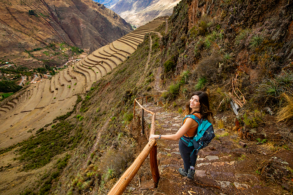 Woman hiking along trails, Sacred Valley, Peru, South America