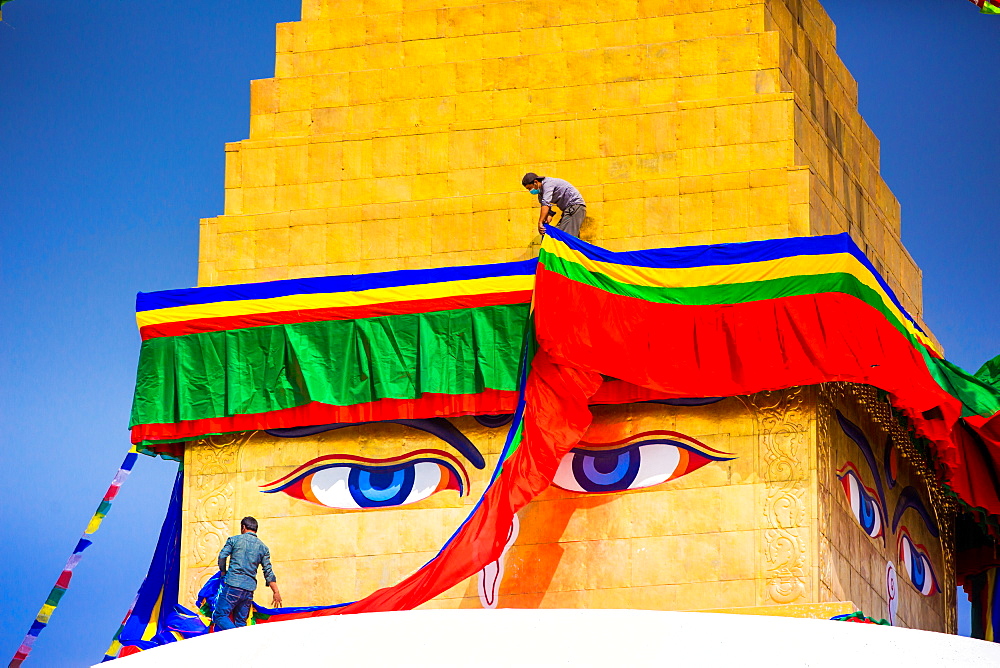 Buddhist Monks decorating the temple at Bouddha (Boudhanath), UNESCO World Heritage Site, Kathmandu, Nepal, Asia