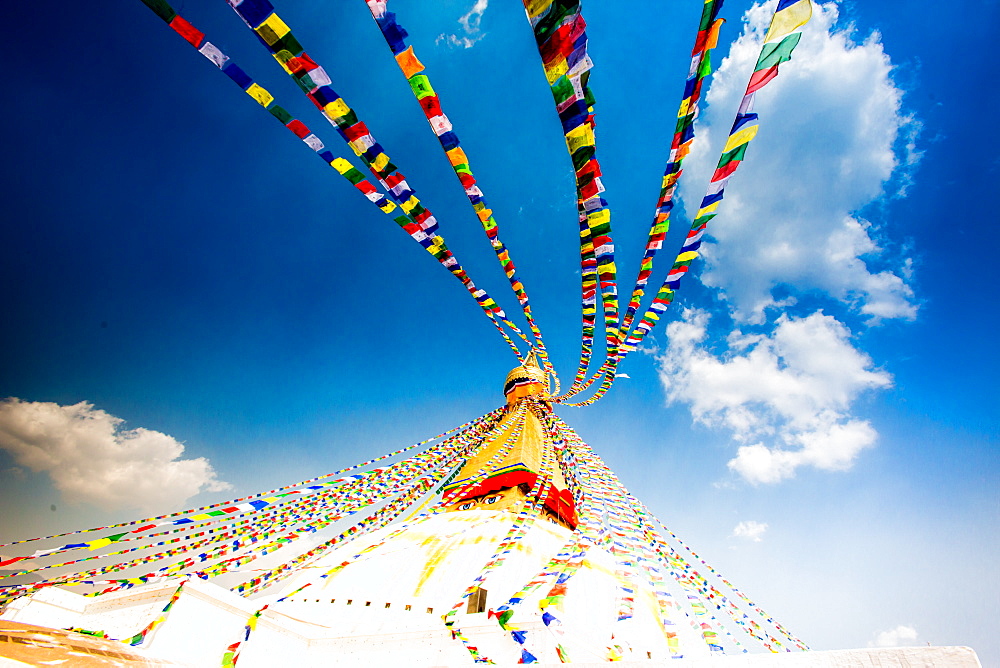 Prayer flags and Buddhist stupa at Bouddha (Boudhanath), UNESCO World Heritage Site, Kathmandu, Nepal, Asia