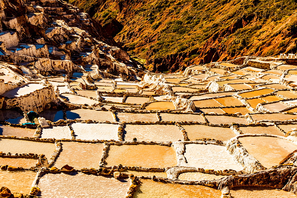 Salt terraces in the Sacred Valley where people are still mining and sifting the terraced pools as the Incas did 1000 years ago, Peru, South America