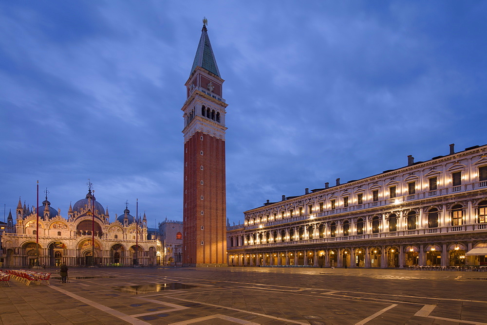 A quiet St. Mark's Square with its Campanile and Basilica during the morning blue hour, Venice, UNESCO World Heritage Site, Veneto, Italy, Europe