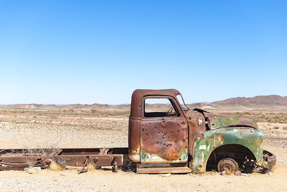 A rusty abandoned car in the desert near Aus in southern Namibia, Africa