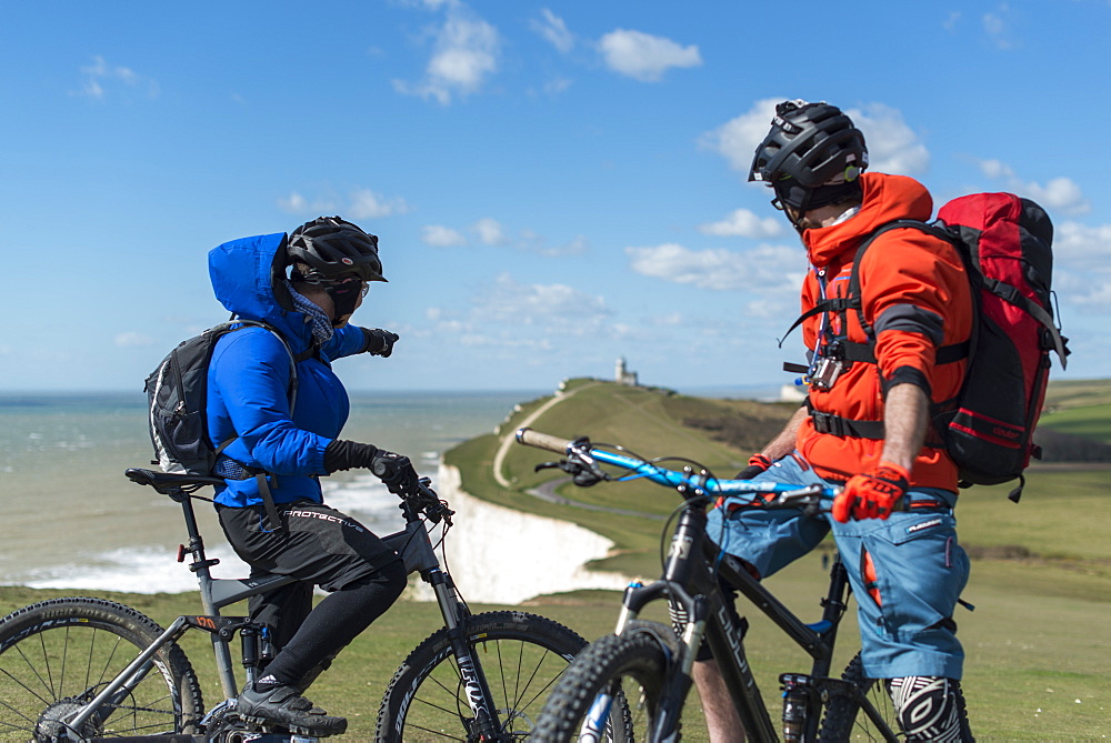 Mountain biking along the chalk cliffs coastal path on the South Downs Way near Beachy Head, South Downs National Park, East Sussex, England, United Kingdom, Europe