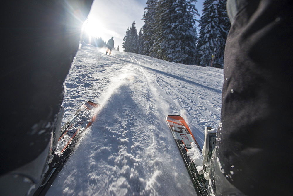 Point of view shot through the legs, of the slopes skiing near Garmisch, Bavaria, Germany, Europe