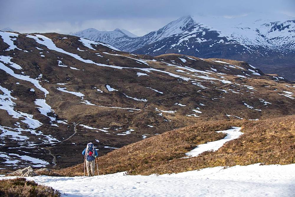 A walker at the top of the Devils Staircase while hiking along the West Highland Way near Glencoe in the Scottish Highlands, Scotland, United Kingdom, Europe