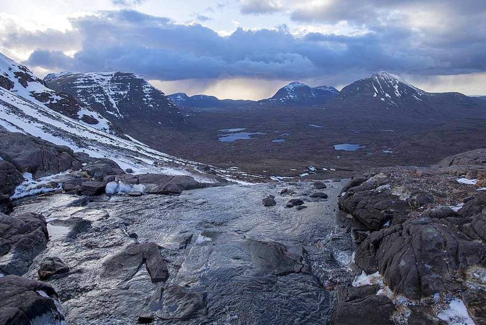 Hiking in the Scottish Highlands in Torridon along The Cape Wrath Trail near Loch Coire Mhic Fhearchair, Highlands, Scotland, United Kingdom, Europe