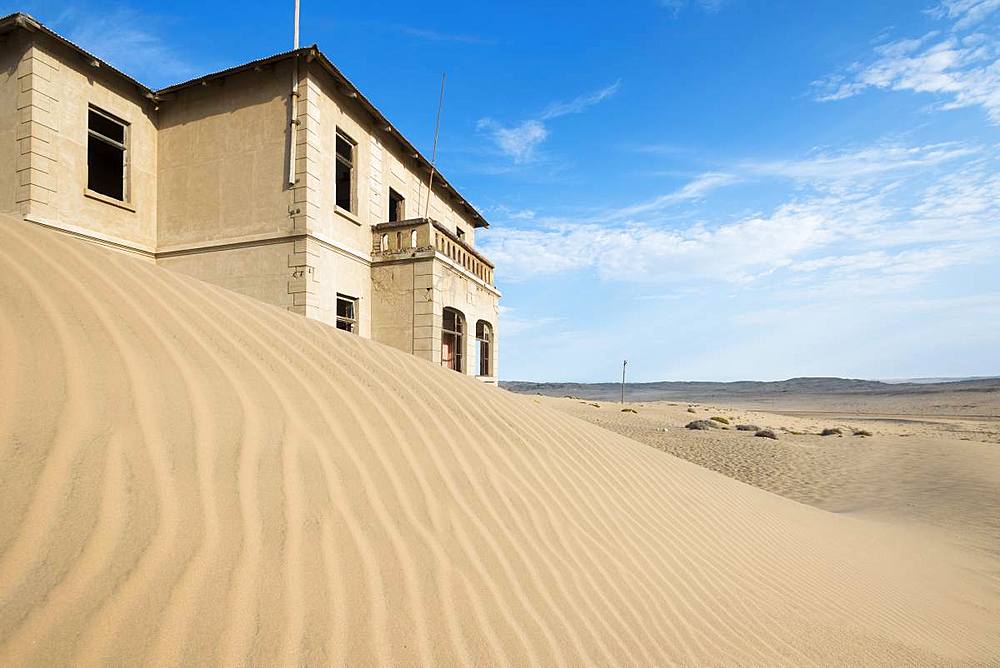 A building in the abandoned diamond mining ghost town of Kolmanskop, Namibia, Africa