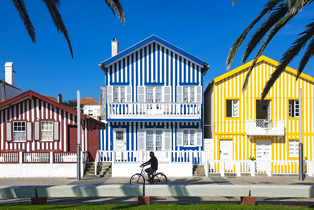 Colourful stripes decorate traditional beach house style on houses in Costa Nova, Portugal, Europe