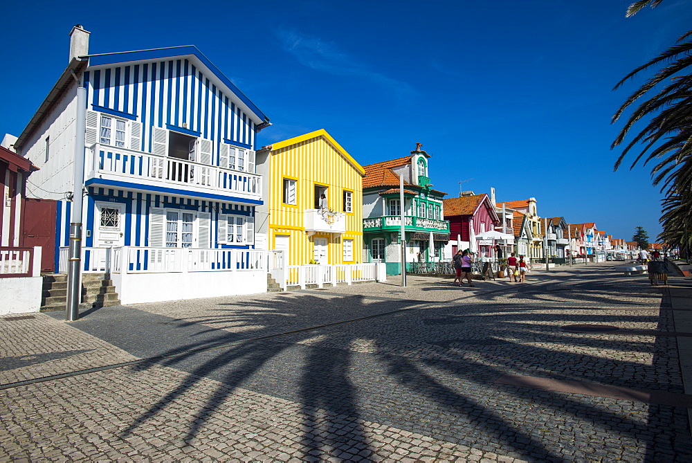 Colourful stripes decorate traditional beach house style on houses in Costa Nova, Portugal, Europe