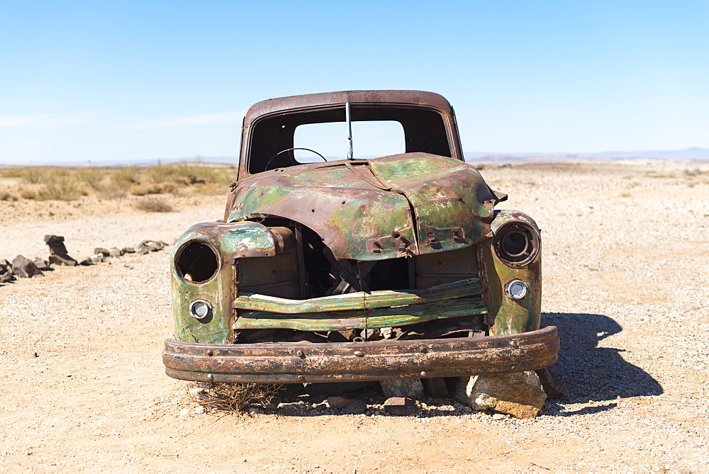 A rusty abandoned car in the desert near Aus in southern Namibia, Africa