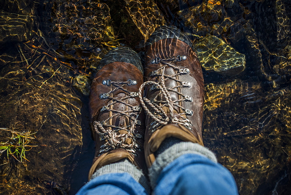 Boots in a stream, Cumbria, England, United Kingdom, Europe