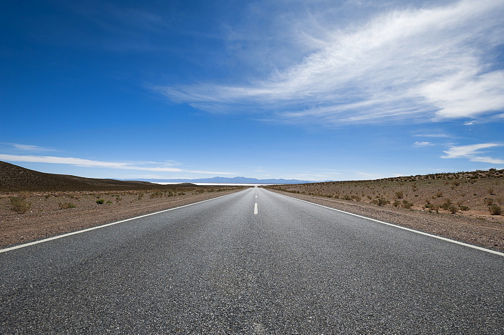 Road leading towards the Salinas Grandes (salt flats) near Purmamarca, Argentina, South America