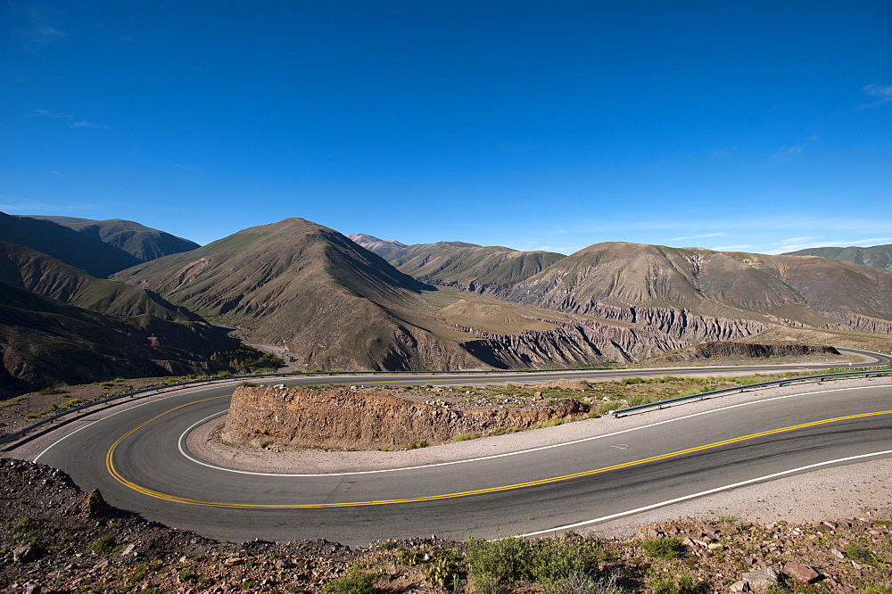 Road leading towards the Salinas Grandes (salt flats) near Purmamarca, Argentina, South America