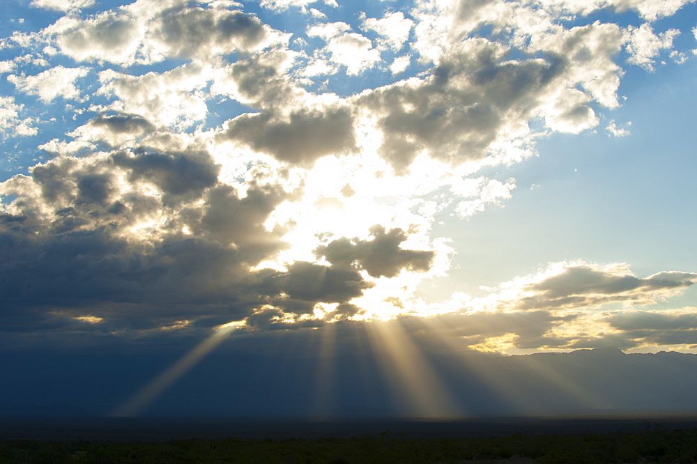 Beams of sunlight shine down to earth, Catamarca, Argentina, South America