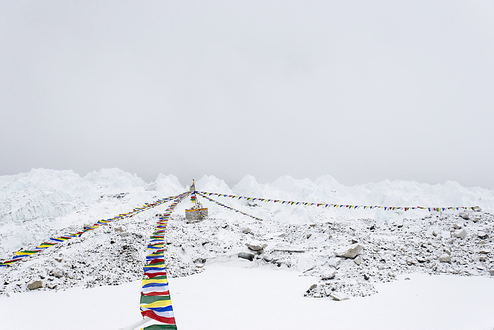 A puja adorned with prayer flags on the Khumbu glacier at Everest Base Camp, Khumbu Region, Nepal, Himalayas, Asia