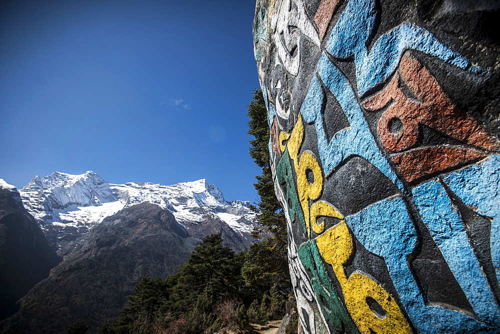 A Mani wall, inscribed with an ancient Buddhist mantra decorates the trail to Everest Base Camp, Nepal, Himalayas, Asia