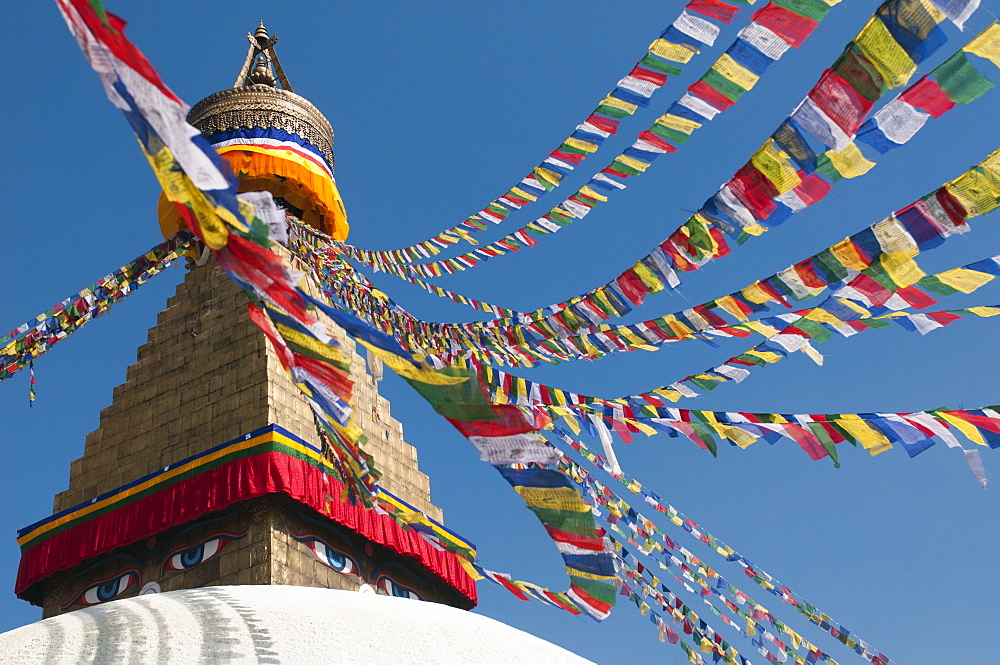 Bouddha (Boudhanath) (Bodnath) in Kathmandu is covered in colourful prayer flags, Kathmandu, Nepal, Asia