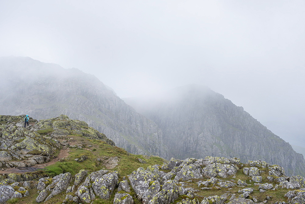 Walking through Crinkle Craggs at the head of the Great Langdale valley on a misty day, Lake District National Park, Cumbria, England, United Kingdom, Europe