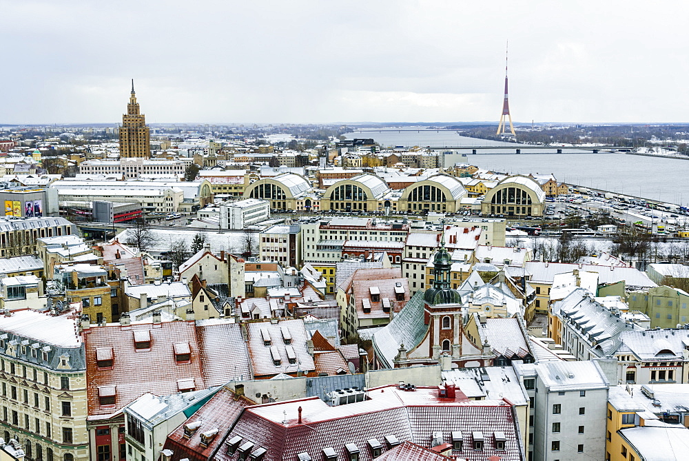 View over Riga Old Town city centre and Daugava River, with snow covered rooftops, UNESCO World Heritage Site, Riga, Latvia, Europe