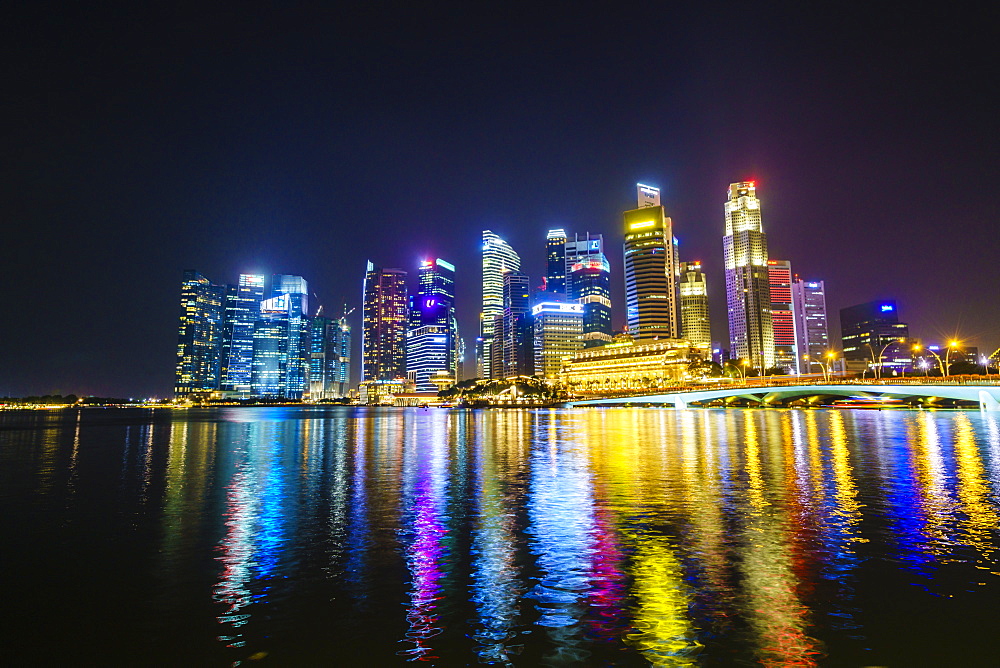 Singapore skyline from Marina Bay at night with the Fullerton Hotel and Jubilee Bridge, Singapore, Southeast Asia, Asia