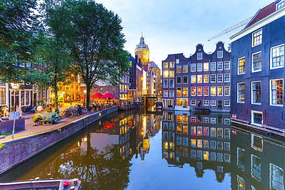 Old gabled buildings by a canal at dusk, Oudezijds Kolk, Amsterdam, North Holland, The Netherlands, Europe