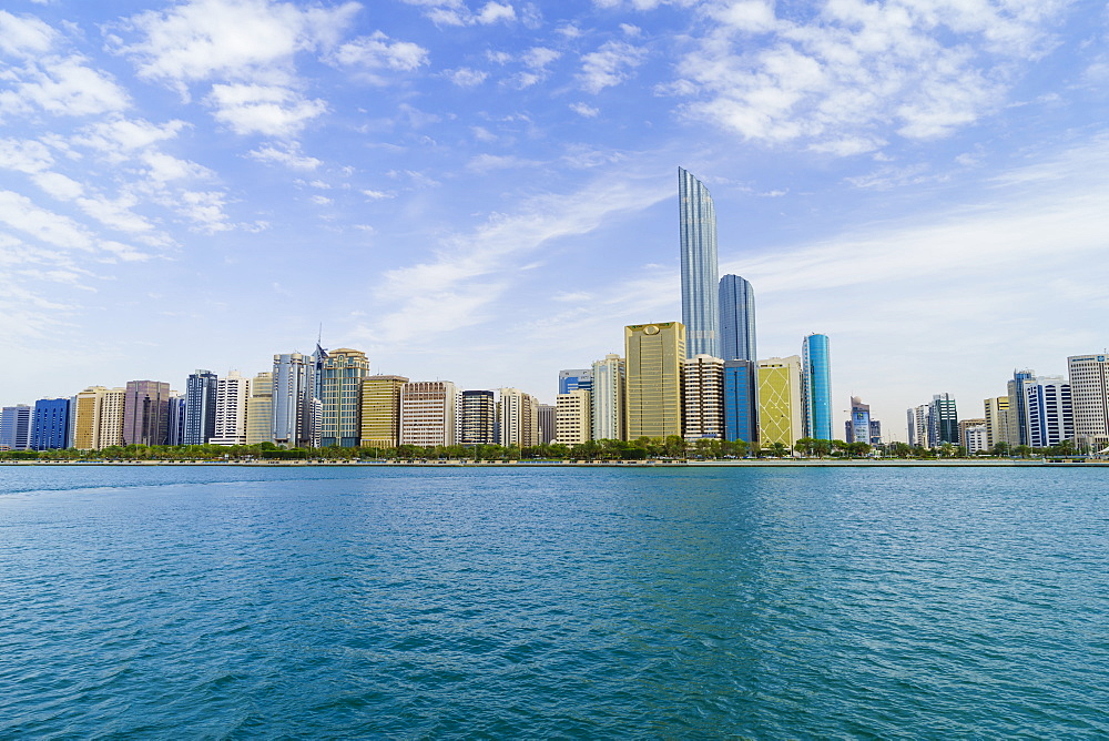 Skyscrapers in the Al Markaziyah district and Corniche viewed from the Gulf, Abu Dhabi, United Arab Emirates, Middle East