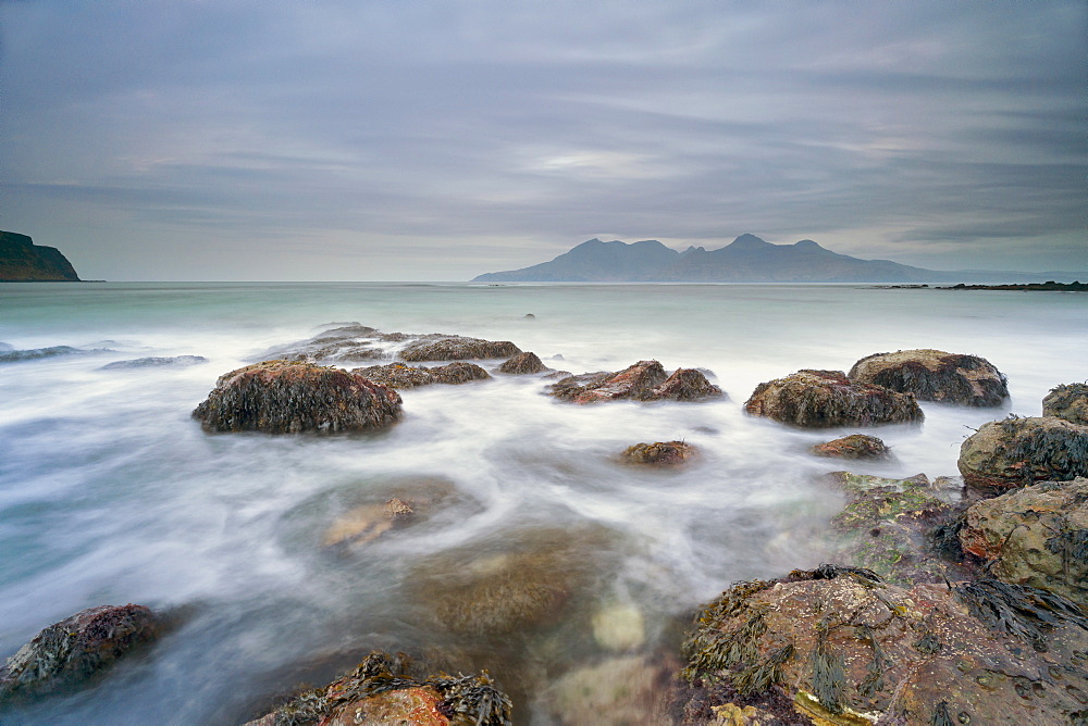 The Isle of Rhum from Laig Bay, Cleadale, Isle of Eigg, Small Isles, Inner Hebrides, Scotland, United Kingdom, Europe