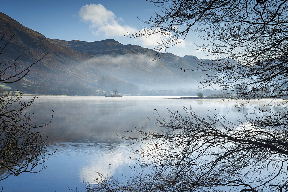 Dawn light and transient sunlit mist over Wall Holm Island on Ullswater, Lake District National Park, UNESCO World Heritage Site, Cumbria, England, United Kingdom, Europe