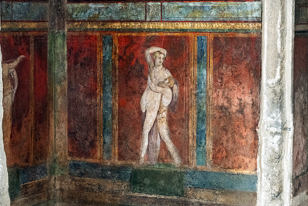 Wall murals in the archeological ruins of Pompeii. A UNESCO World Heritage site. Italy, Europe.