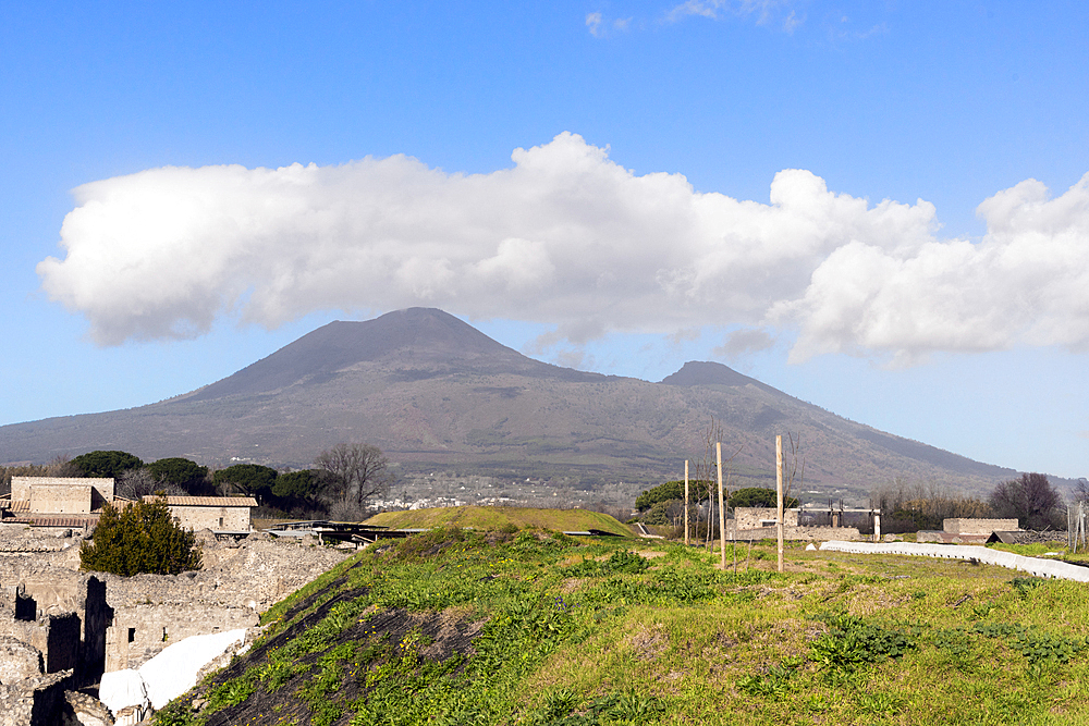 Mount Vesuvius. A volcano located on the Bay of Naples in Campania, Italy, about 9 km (5.6 mi) east of the city of Naples.