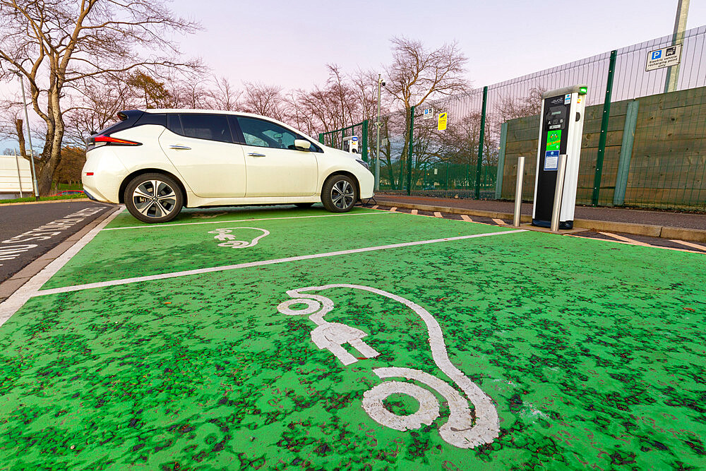 Electric car charging point and car parking space, Glasgow, Scotland, United Kingdom, Europe