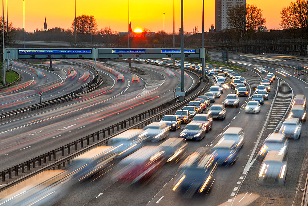 Sunset over M8 motorway traffic, Glasgow, Scotland, United Kingdom, Europe