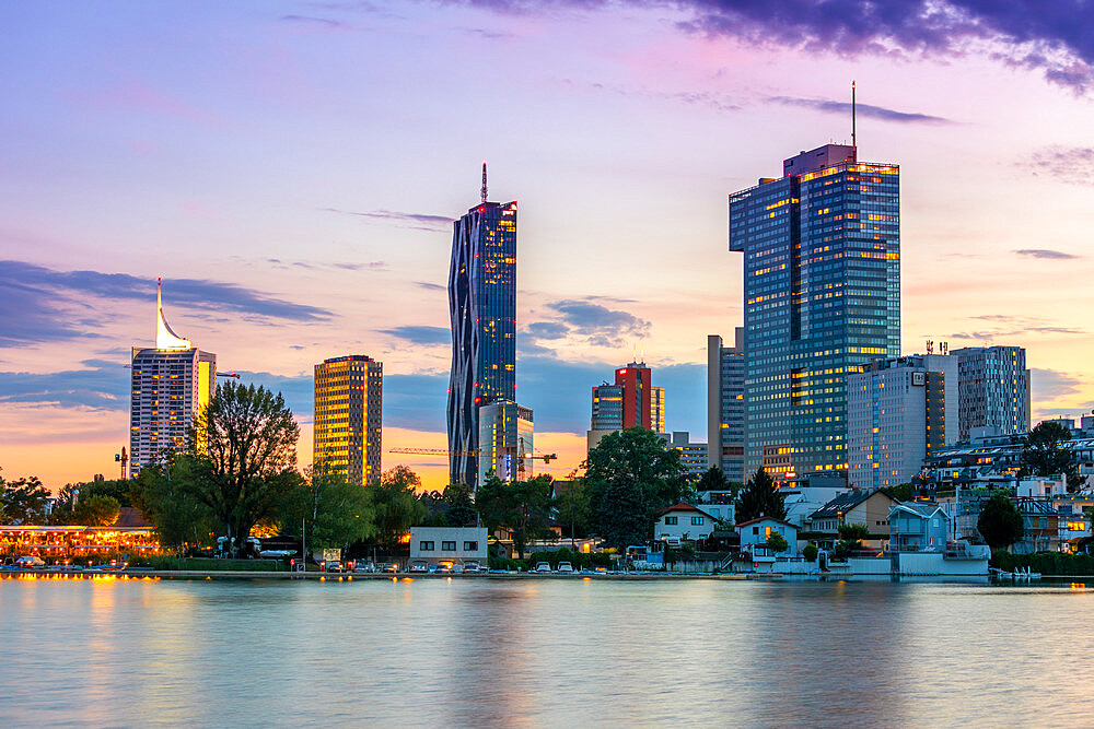 City Skyline at dusk, River Danube, Alte Donau, Vienna, Austria, Europe