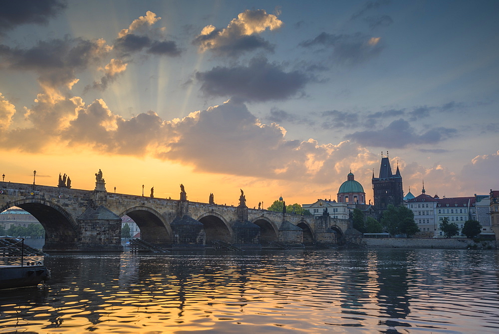 Colourful sunrise over the Charles Bridge with the Old Town Tower and Stare Mesto, UNESCO World Heritage Site, Prague, Czech Republic, Europe