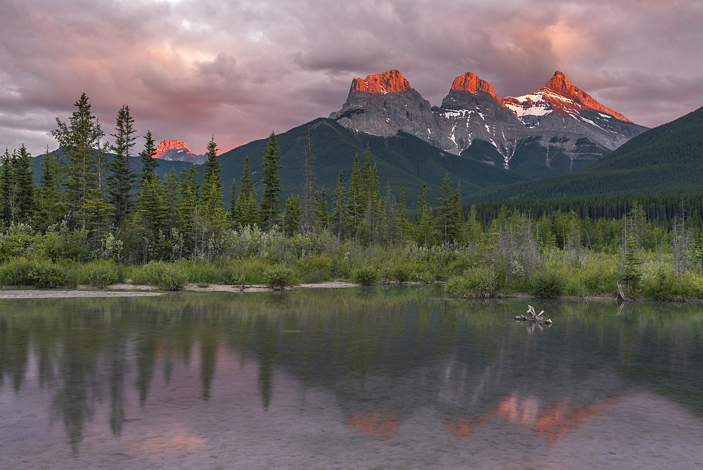 Sunset and Alpenglow on the peaks of Three Sisters, Canmore, Alberta, Canadian Rockies, Canada, North America