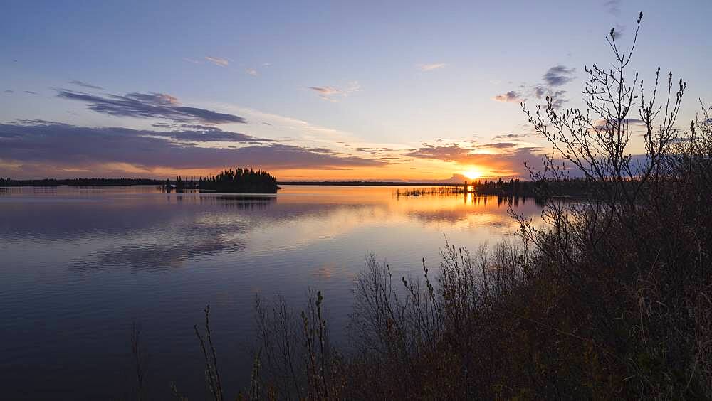 Colourful sunset in Spring at Astotin Lake, Elk Island National Park, Alberta, Canada, North America