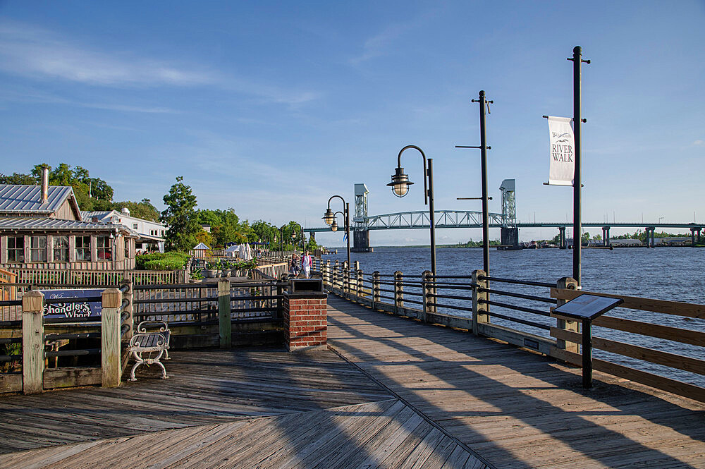 Sunset on the Riverwalk along the Cape Fear River with river bridge in the background, Wilmington, North Carolina, United States of America, North America