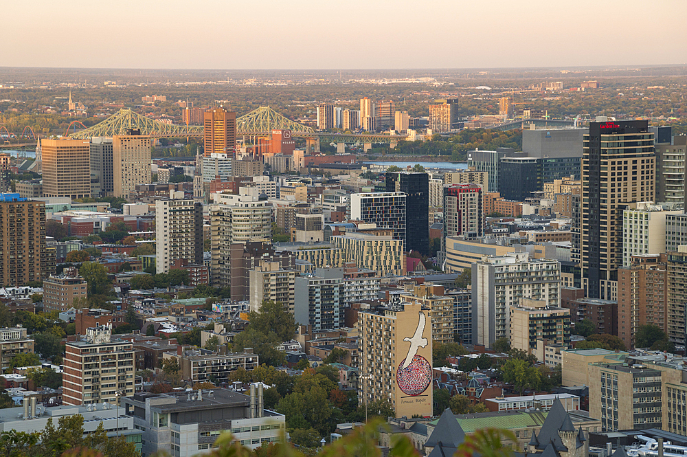 View of Montreal city skyline from Mont Royal Park in autumn at sunset, Montreal, Quebec, Canada, North America