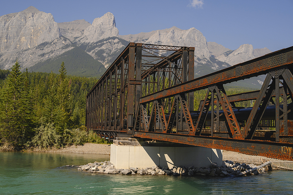 Bow River Iron Bridge and Mount Lawrence Grassi on a hazy summer evening caused by wildlife smoke, Canmore, Alberta, Canadian Rockies, Canada, North America