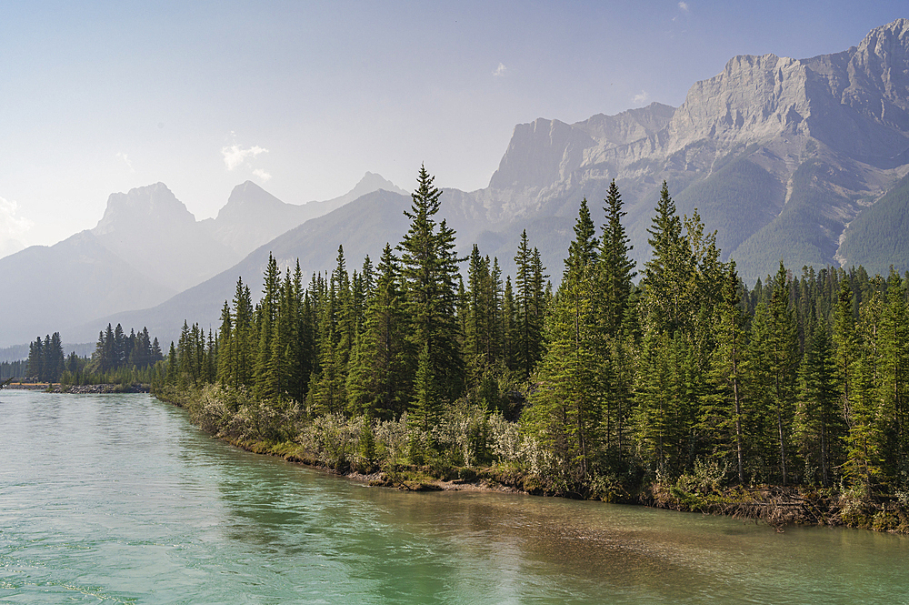 Bow River and Mount Lawrence Grassi on a hazy summer evening caused by wildlife smoke, Canmore, Alberta, Canadian Rockies, Canada, North America