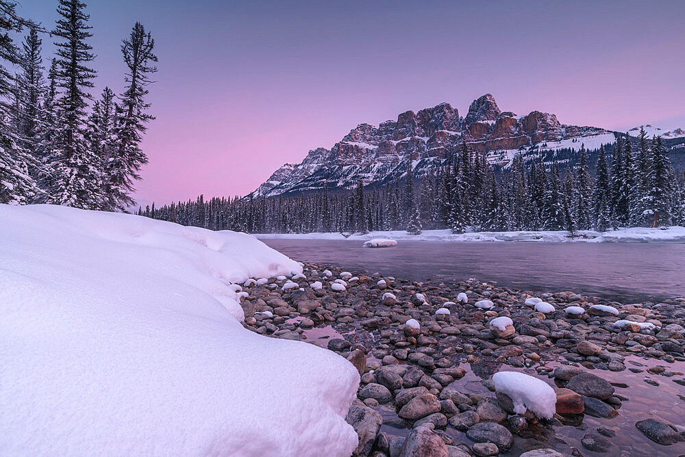 Sunrise and snowy landscape during winter at Bow River and Castle Mountain in Banff National Park, UNESCO World Heritage Site, Alberta, The Rockies, Canada, North America