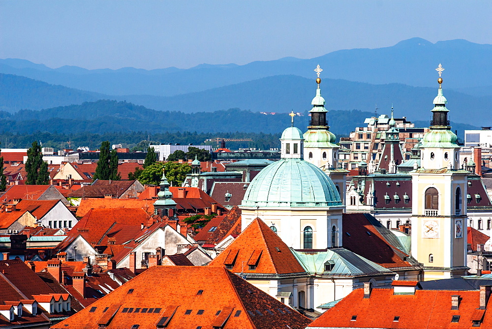 City rooftops with mountains, Ljubljana, Slovenia, Europe