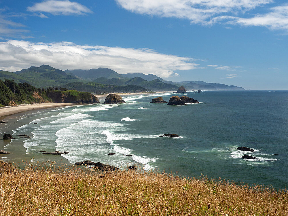 Crashing waves, mountains, and sea stacks in Ecola State Park on the Oregon coast, Oregon, United States of America, North America