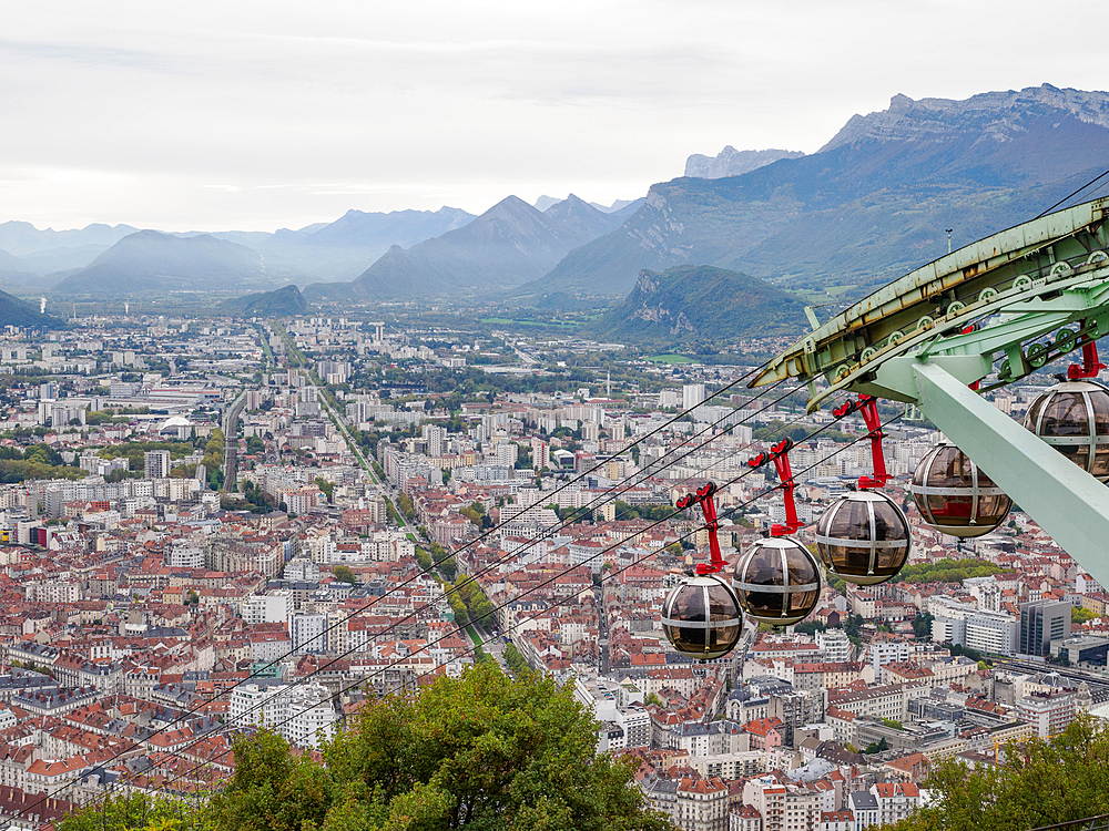 View from the Bastille hill over Grenoble with mountains in the background and cable car in the foreground, Grenoble, Auvergne-Rhone-Alpes, France, Europe