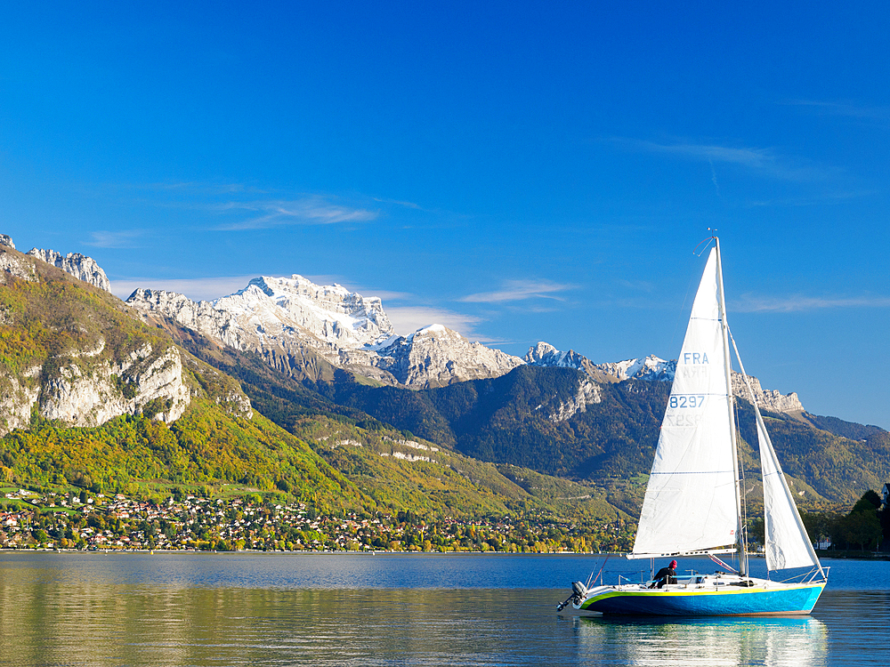 A sailboat on Lake Annecy on a beautiful late-fall day, Annecy, Haute-Savoie, France, Europe