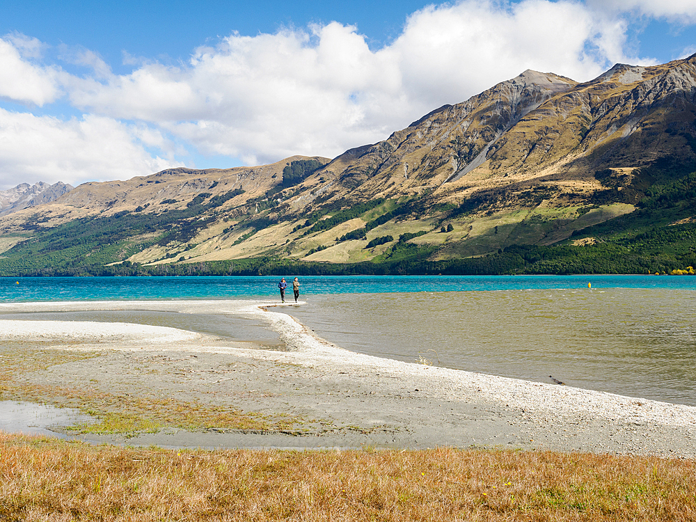 Walkers on a beach in Glenorchy, Otago, South Island, New Zealand, Pacific